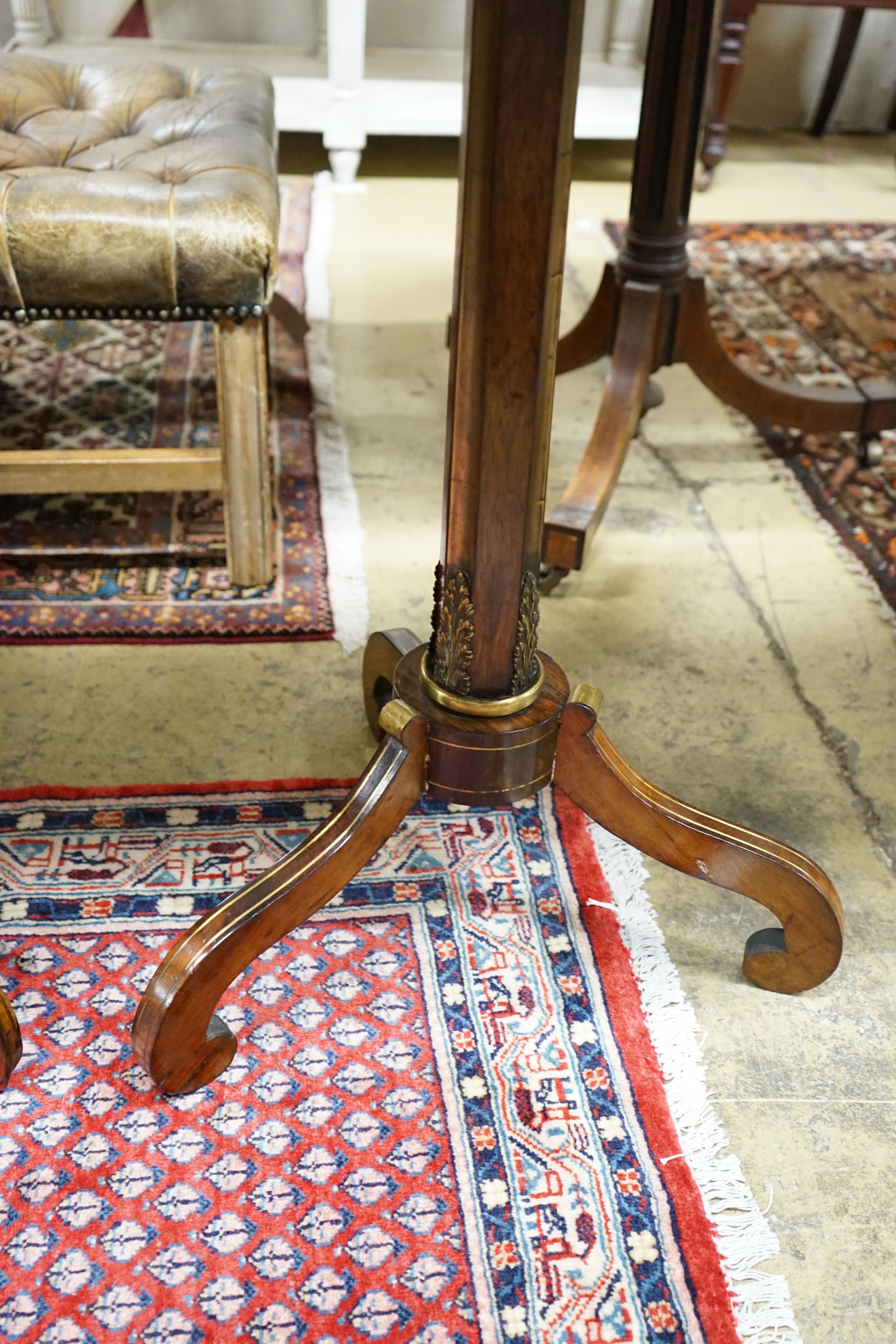 A Regency style brass mounted octagonal rosewood tripod occasional table, width 51cm, height 70cm